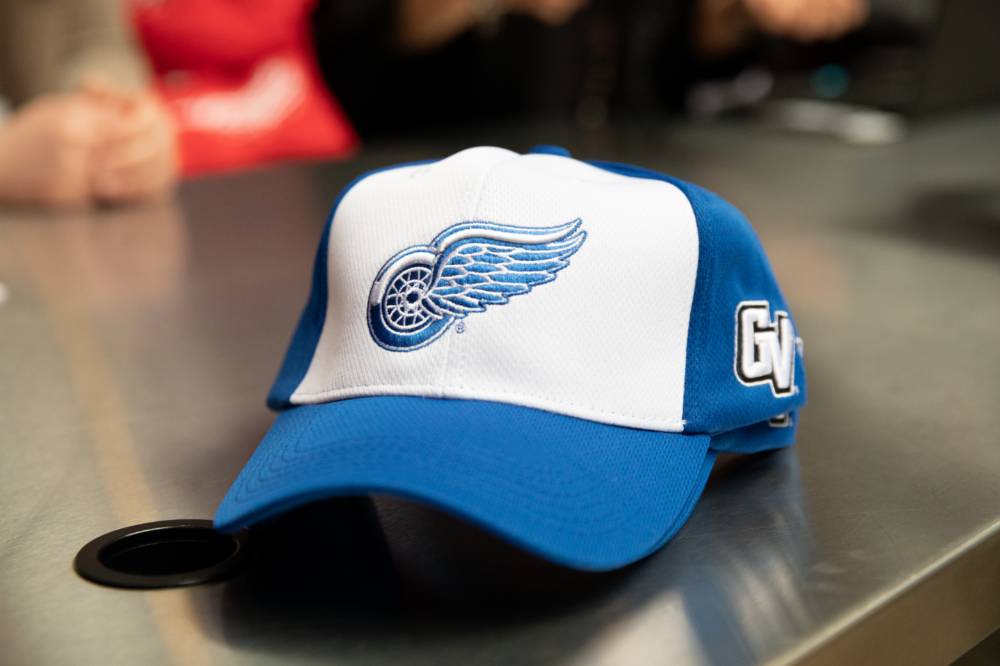 A photo of the GV Red Wings hat at the Detroit Red Wings GVSU Night